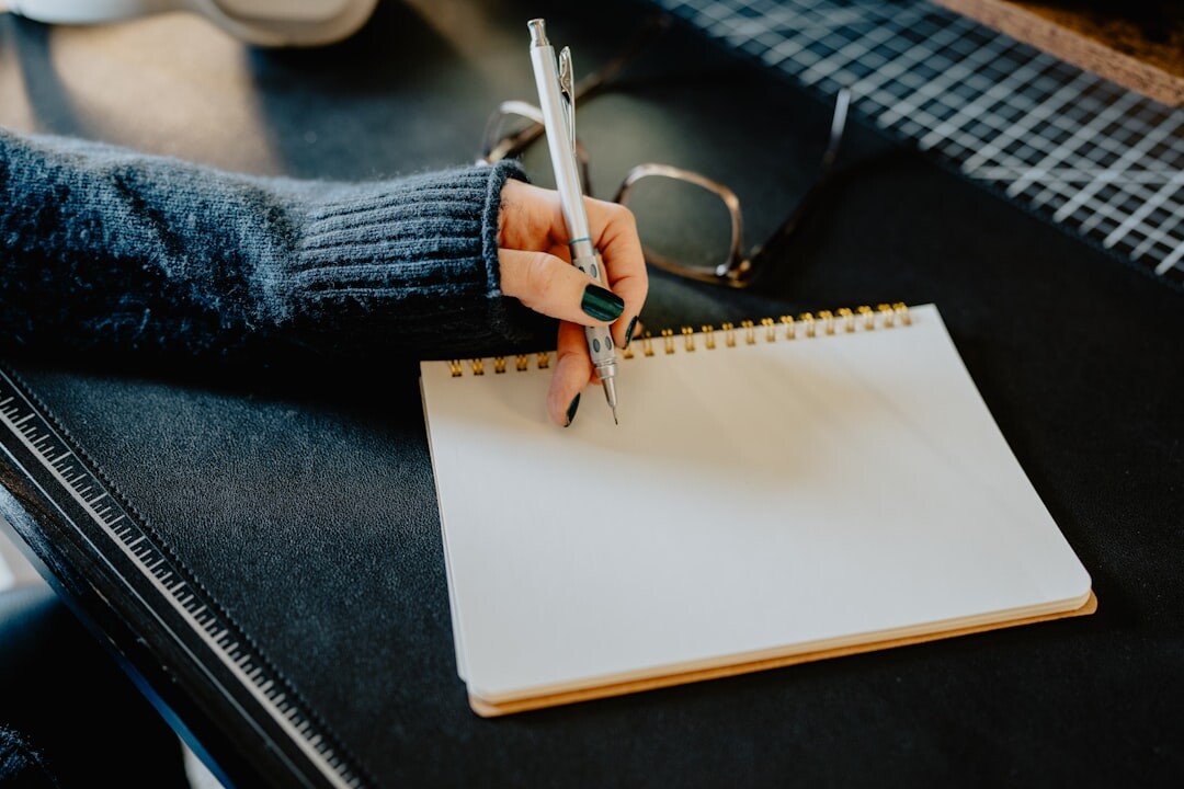 writer at desk with notebook